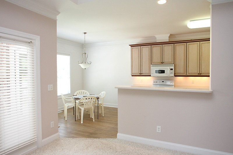 11612 Midlavian Drive Raleigh, NC 27614 - Photo 6 of 25 The family room with windows across the back opens to the kitchen and nook. View of kitchen from the family room