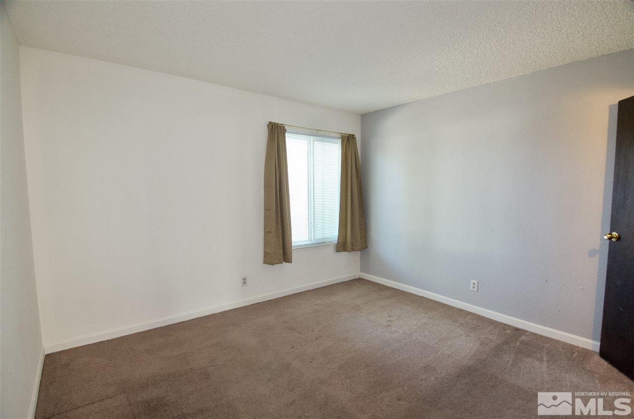 4606 Neil Road, Unit 167 Reno, NV 89502 - Photo 16 of 25 an empty room with a window