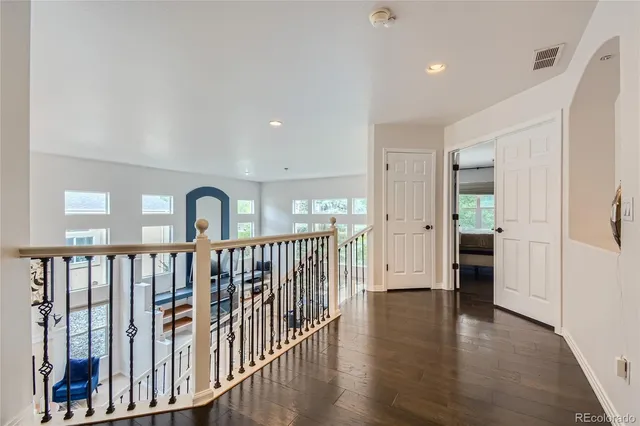a view of hallway with wooden floor