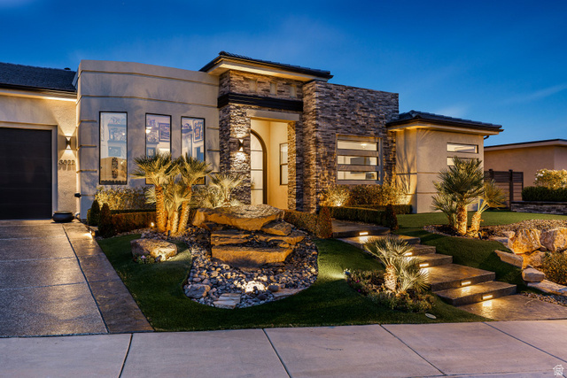 3022 West Sesia Way St. George, UT 84770 - Photo 43 of 52 View of front of home with stone siding, stucco siding, concrete driveway, and a garage