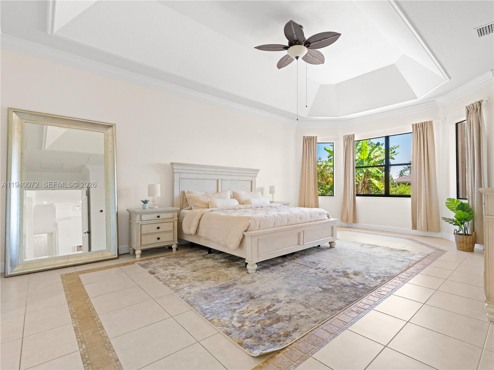 15016 Southwest 35th Street Davie, FL 33331 - Photo 18 of 50 a bedroom with a bed and a chandelier