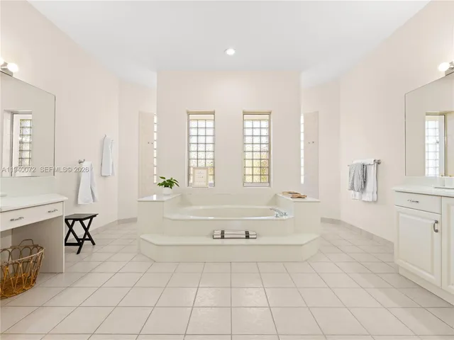 a living room with furniture a rug and a window