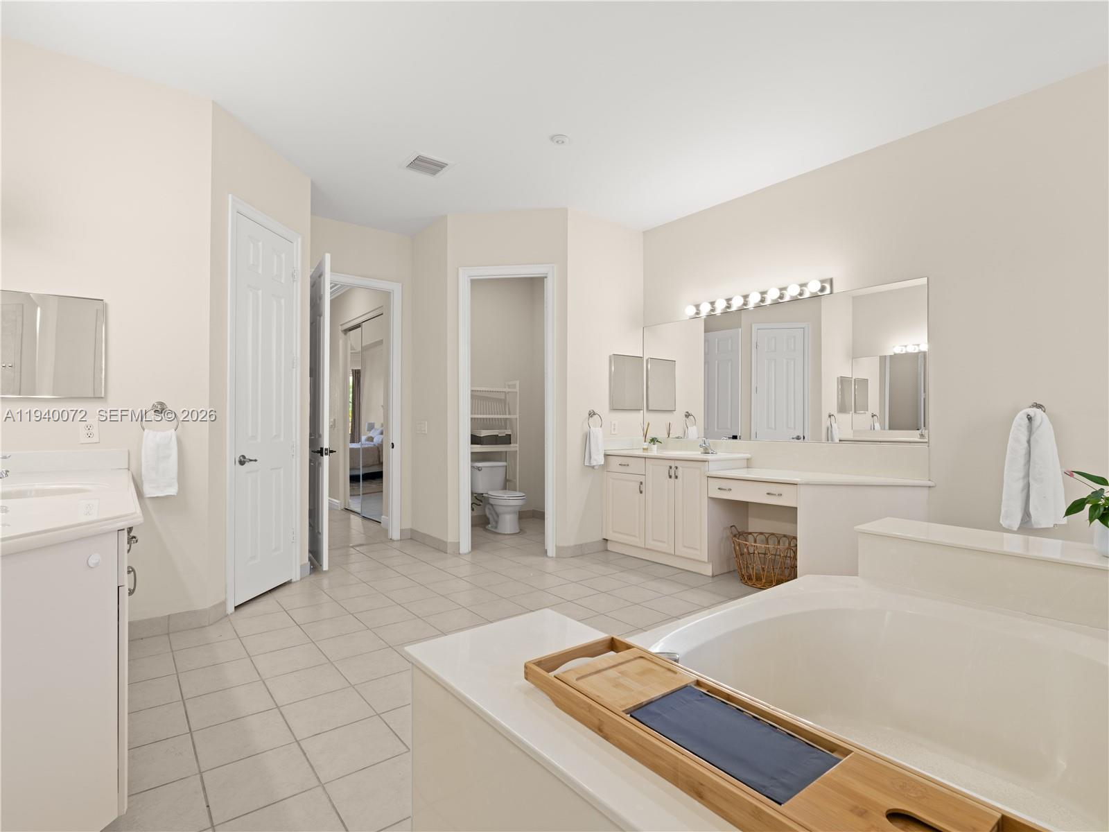 15016 Southwest 35th Street Davie, FL 33331 - Photo 23 of 50 a large white room with a sink a washer and dryer