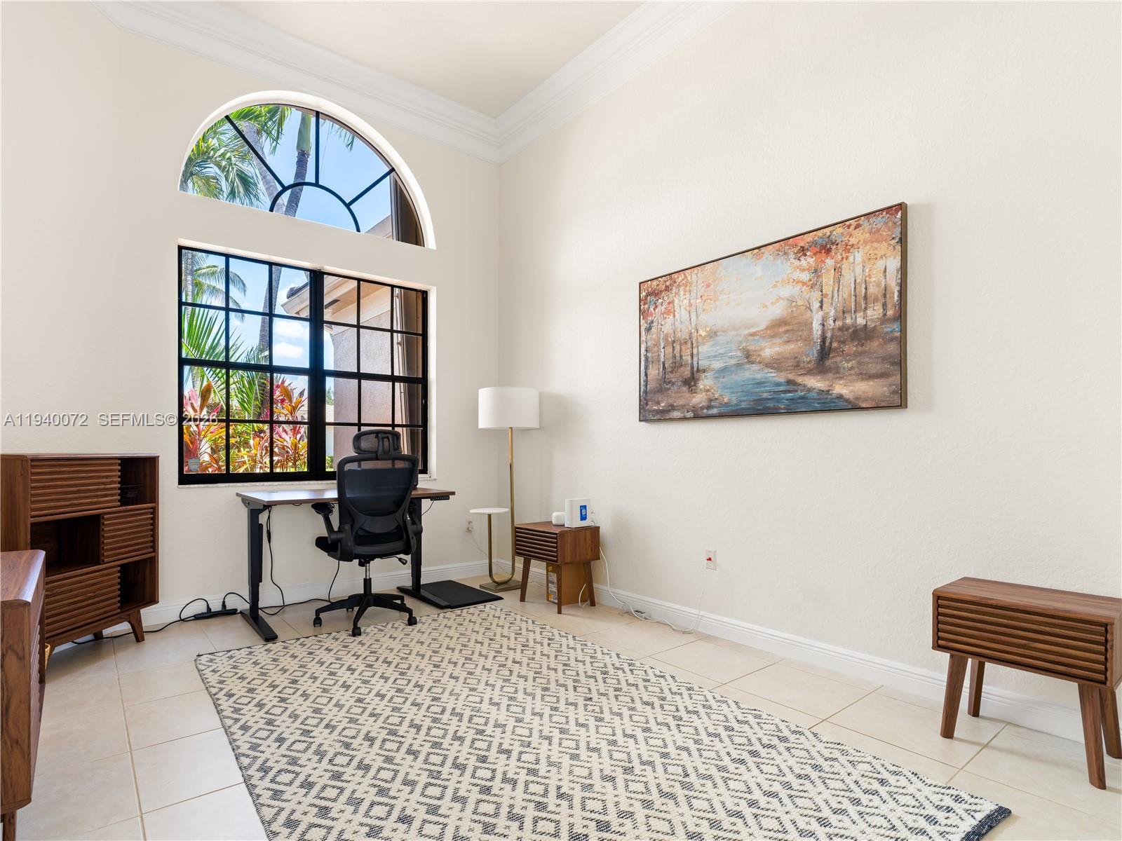 15016 Southwest 35th Street Davie, FL 33331 - Photo 25 of 50 a living room with furniture a rug and a window