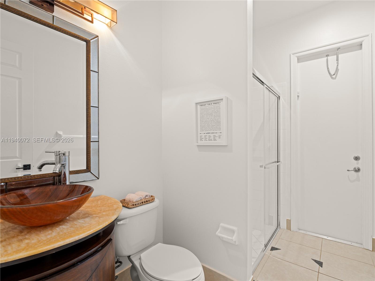 15016 Southwest 35th Street Davie, FL 33331 - Photo 26 of 50 a bathroom with a sink toilet and shower