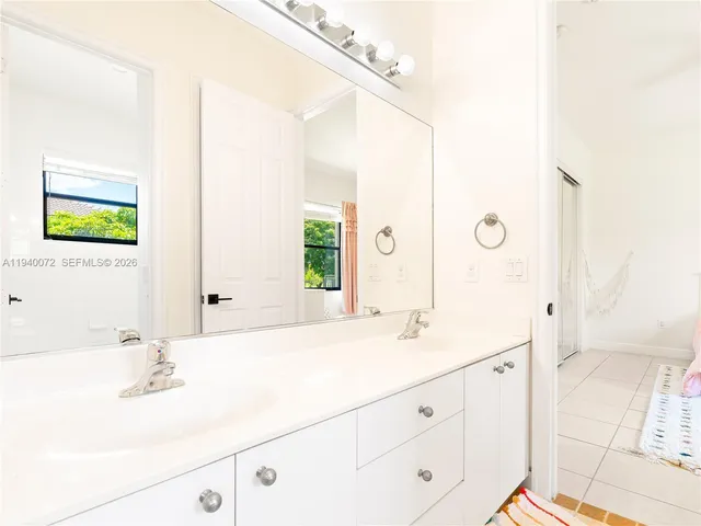 a utility room with sink dryer and washer