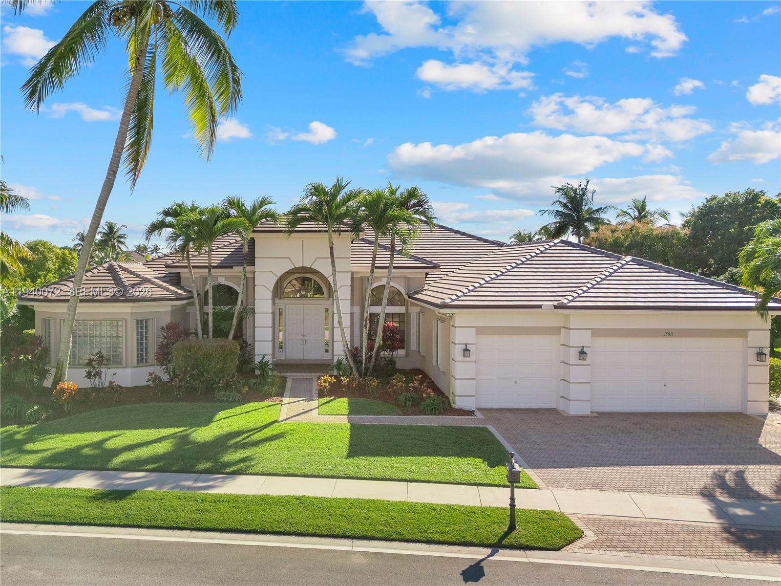 15016 Southwest 35th Street Davie, FL 33331 - Photo 3 of 50 a front view of a house with a yard