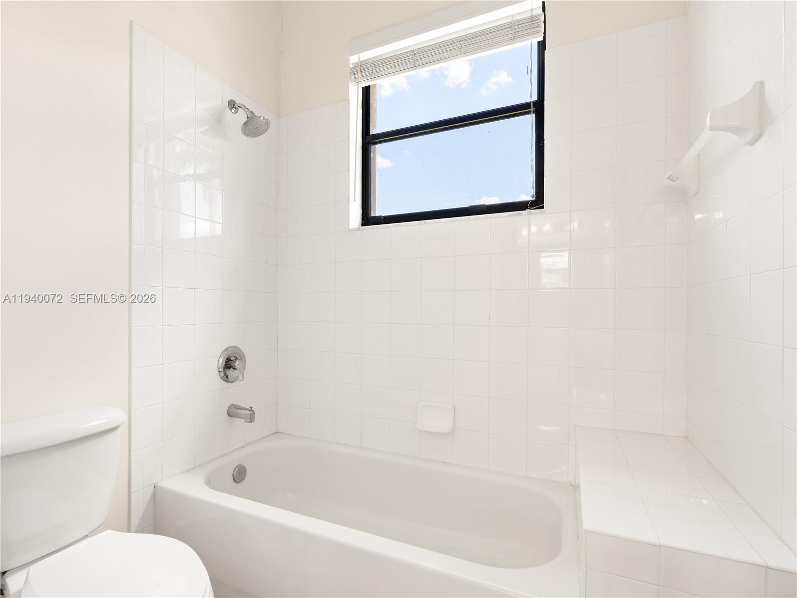 15016 Southwest 35th Street Davie, FL 33331 - Photo 31 of 50 a white bath tub sitting next to a toilet