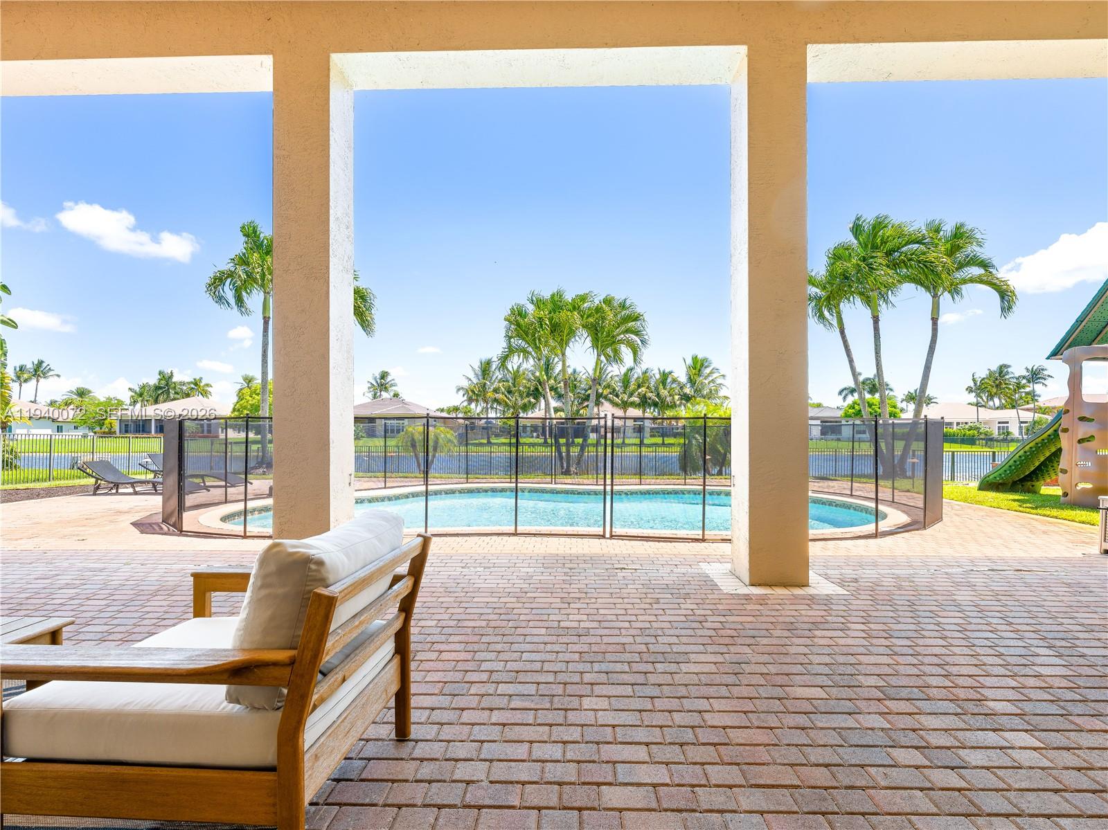15016 Southwest 35th Street Davie, FL 33331 - Photo 37 of 50 a view of swimming pool with outdoor seating