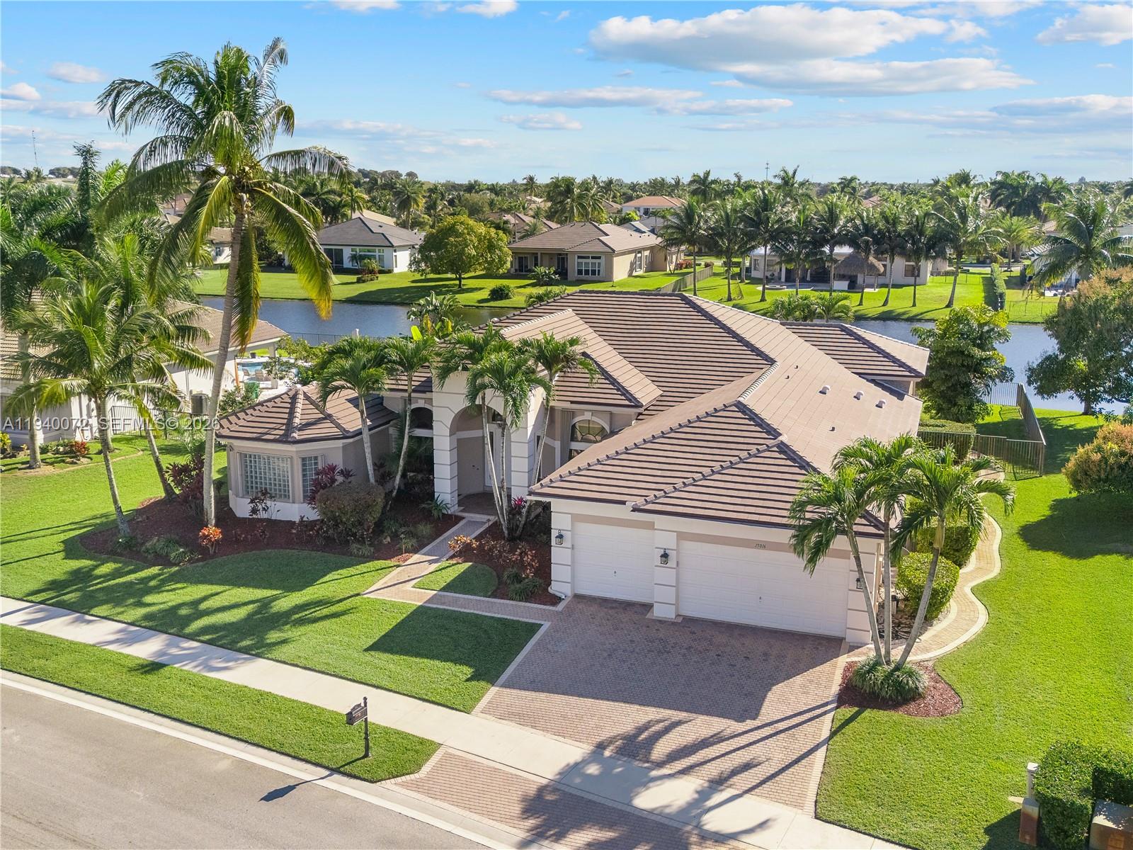 15016 Southwest 35th Street Davie, FL 33331 - Photo 4 of 50 a view of a house with a yard and potted plants
