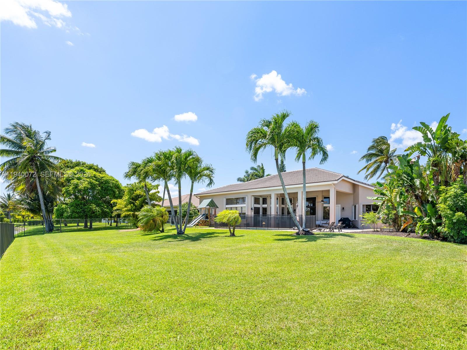 15016 Southwest 35th Street Davie, FL 33331 - Photo 42 of 50 a view of house with swimming pool and yard