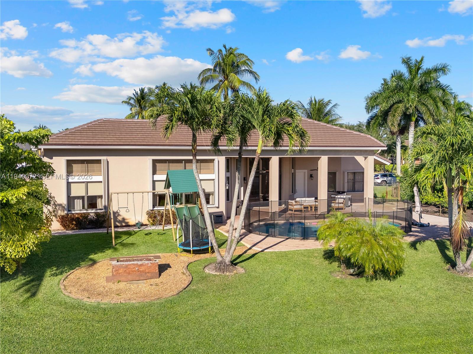15016 Southwest 35th Street Davie, FL 33331 - Photo 44 of 50 a view of a house with backyard porch and sitting area