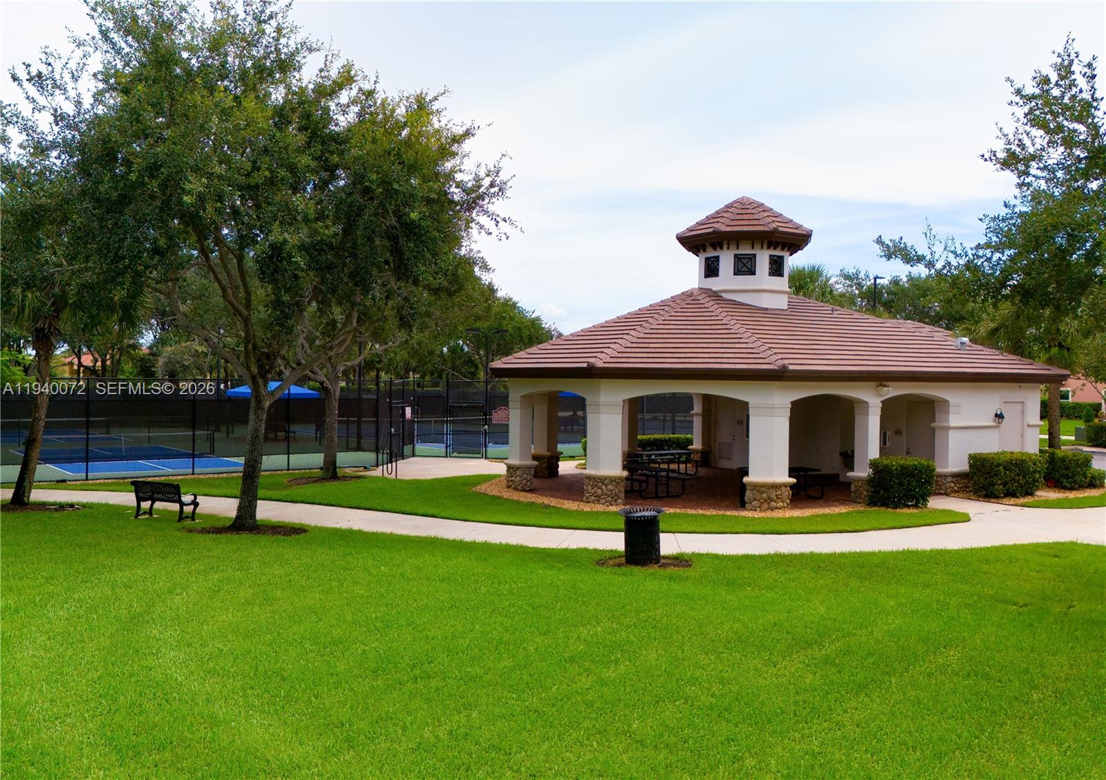 15016 Southwest 35th Street Davie, FL 33331 - Photo 49 of 50 a front view of house with yard and green space