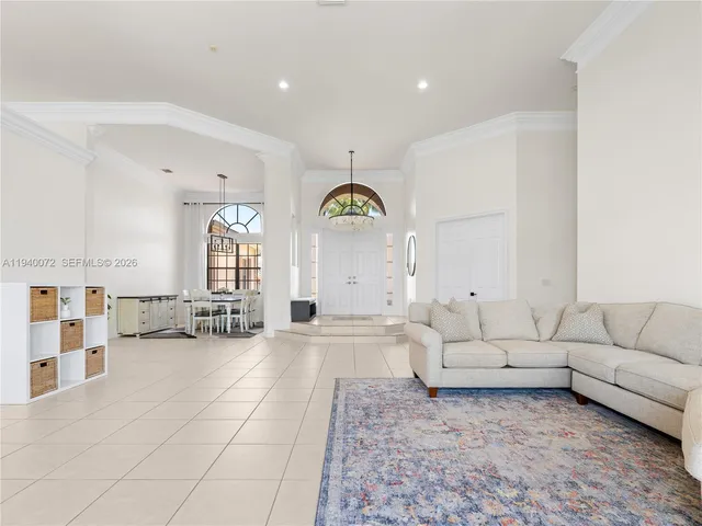 a living room with furniture and white walls