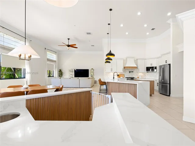 a view of a dining room with furniture and window