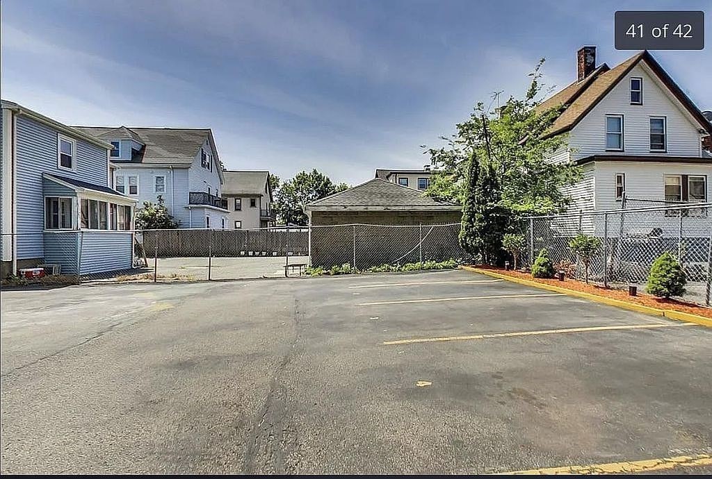 28 Francis Street, Unit 2 Waltham, MA 02451 - Photo 11 of 11 a front view of a house with a yard