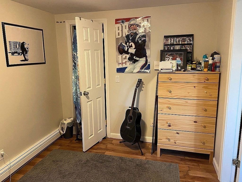 28 Francis Street, Unit 2 Waltham, MA 02451 - Photo 9 of 11 a view of walk in closet with clothes