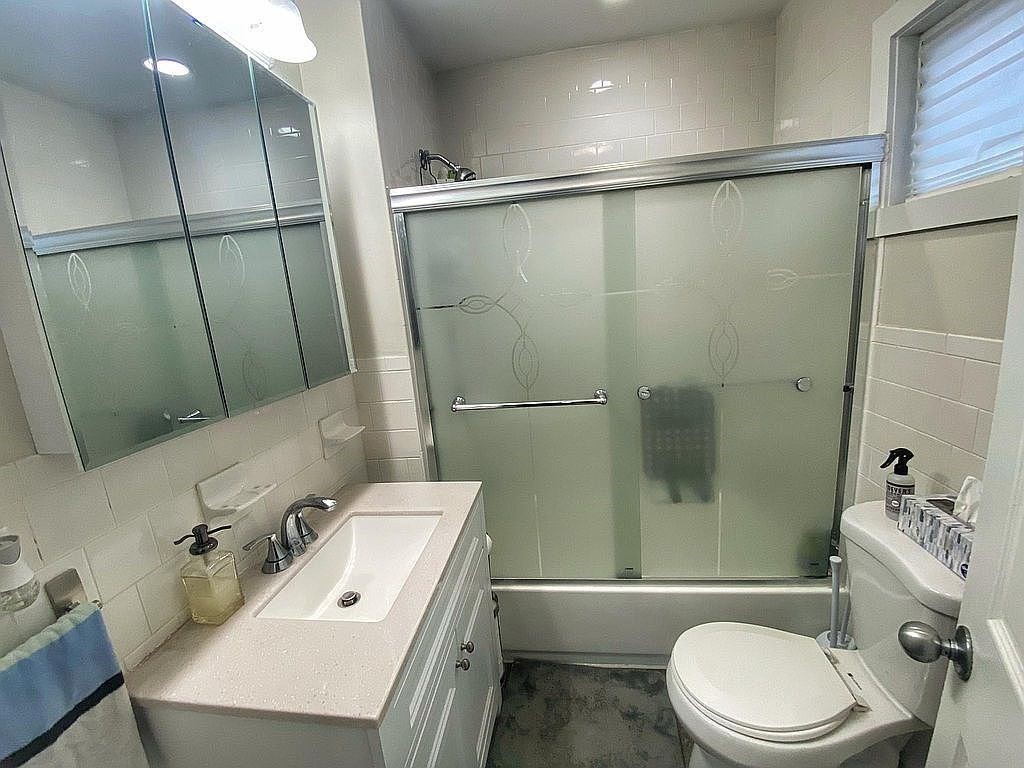 28 Francis Street, Unit 2 Waltham, MA 02451 - Photo 10 of 11 a bathroom with a sink a toilet and shower