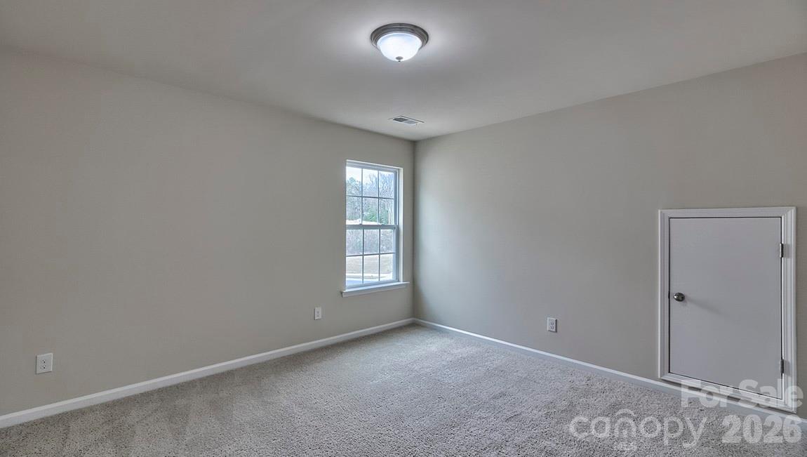 109 Piney Wds Road Fletcher, NC 28732 - Photo 19 of 28 an empty room with windows and closet