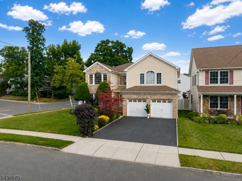 419 Putnam Road Union, NJ 07083 - Photo 3 of 37 a front view of a house with a garden and yard
