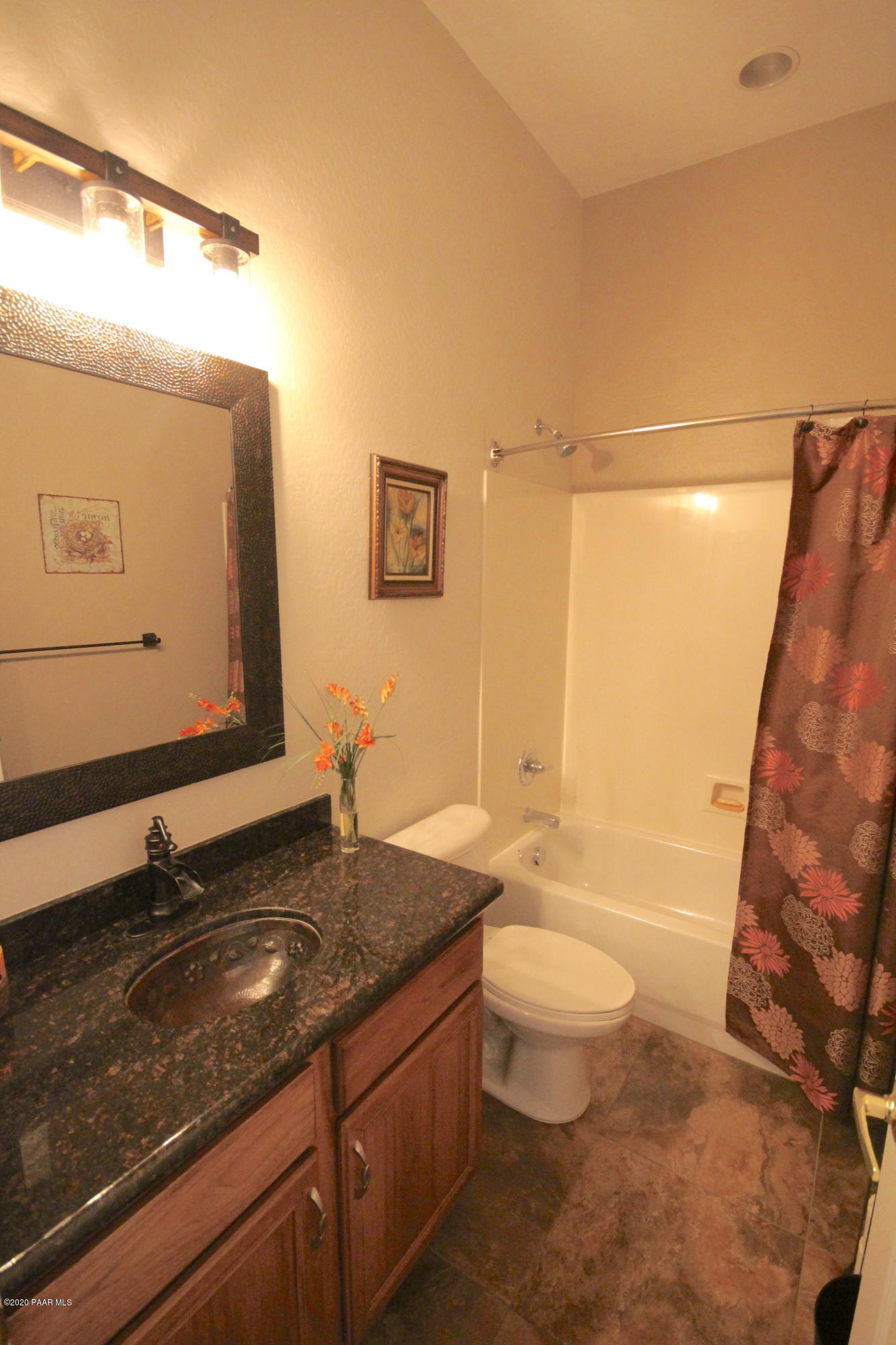 4870 Edgemont Road Prescott Valley, AZ 86314 - Photo 23 of 27 a bathroom with a granite countertop sink toilet and shower