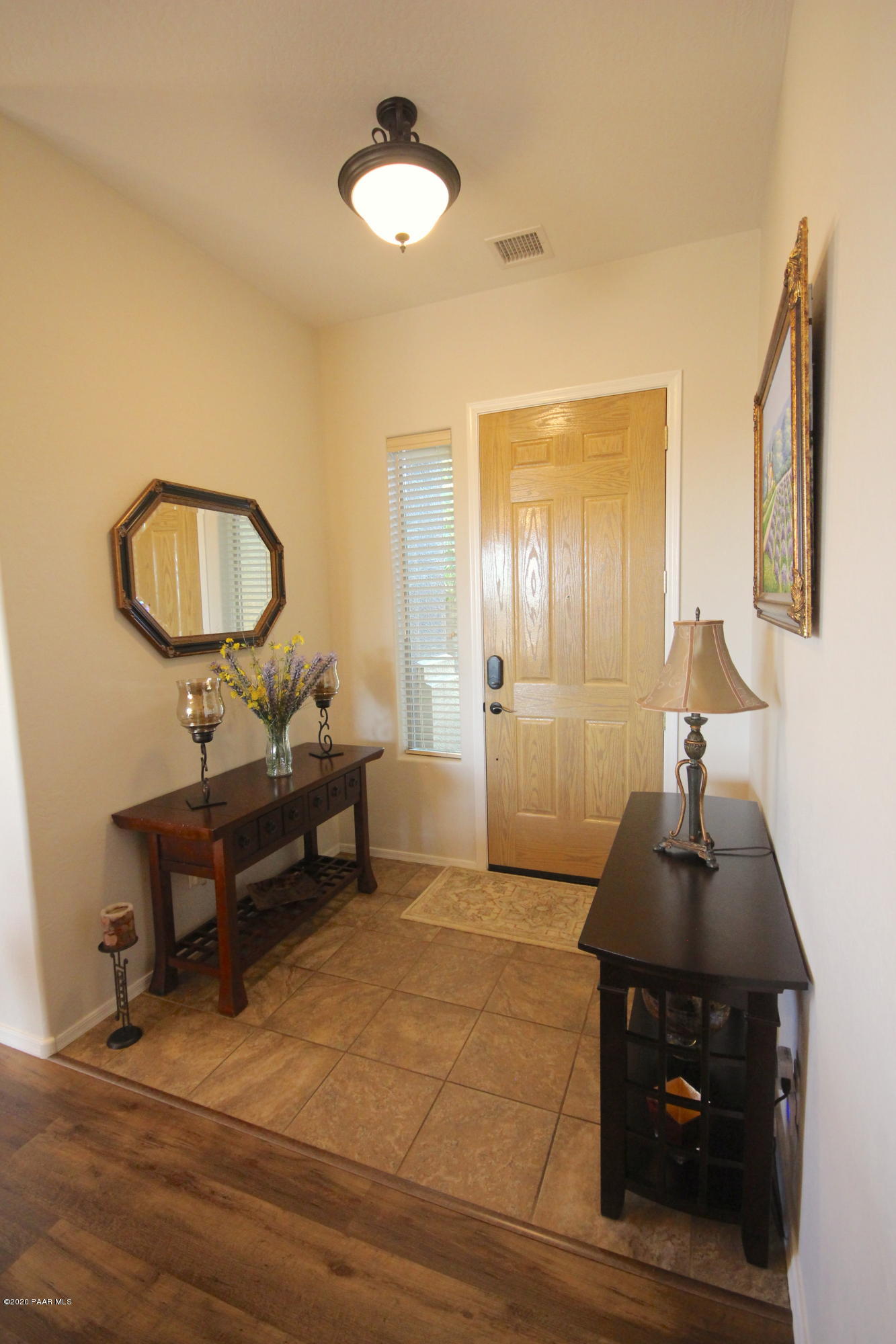 4870 Edgemont Road Prescott Valley, AZ 86314 - Photo 9 of 27 a living room with furniture and a mirror