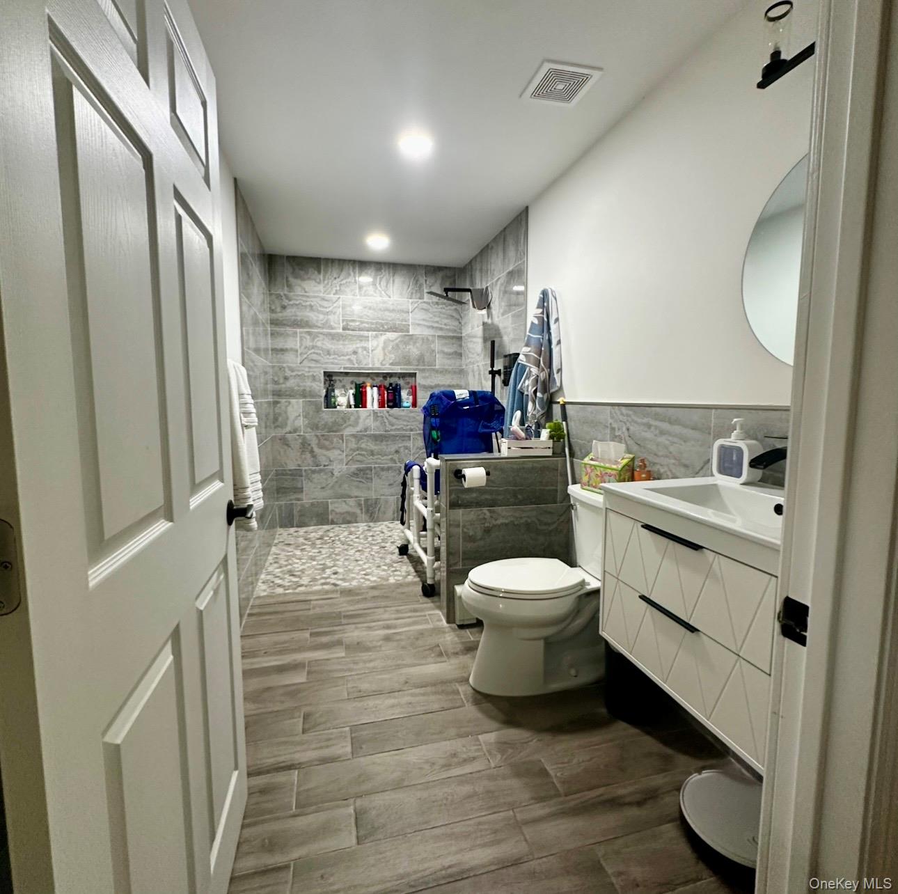 189 Southfield Road Calverton, NY 11933 - Photo 10 of 12 a bathroom with a sink toilet and shower