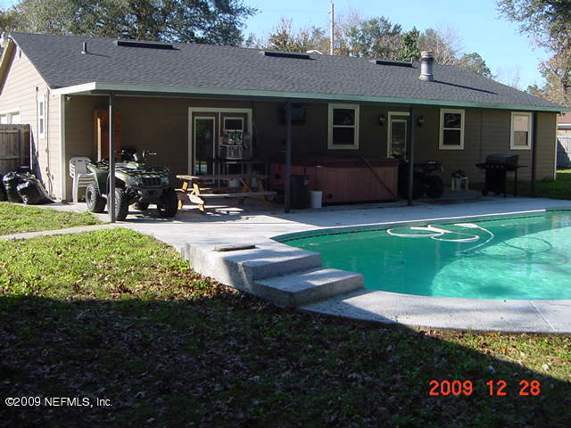 12693 Beaubien Road Jacksonville, FL 32258 - Photo 1 of 6 a view of a house with backyard and porch