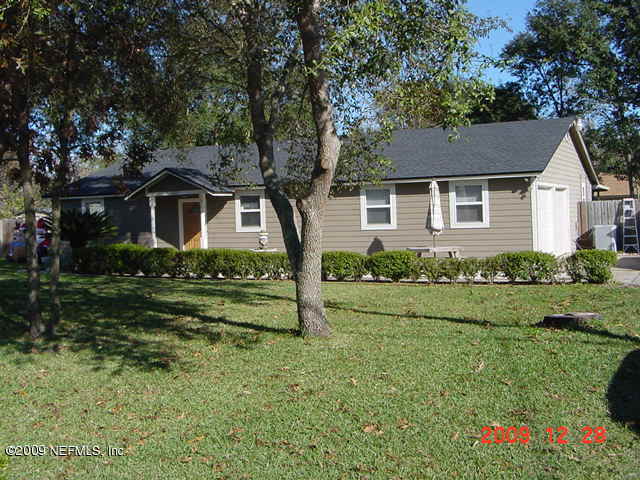 12693 Beaubien Road Jacksonville, FL 32258 - Photo 3 of 6 front view of a house with a yard
