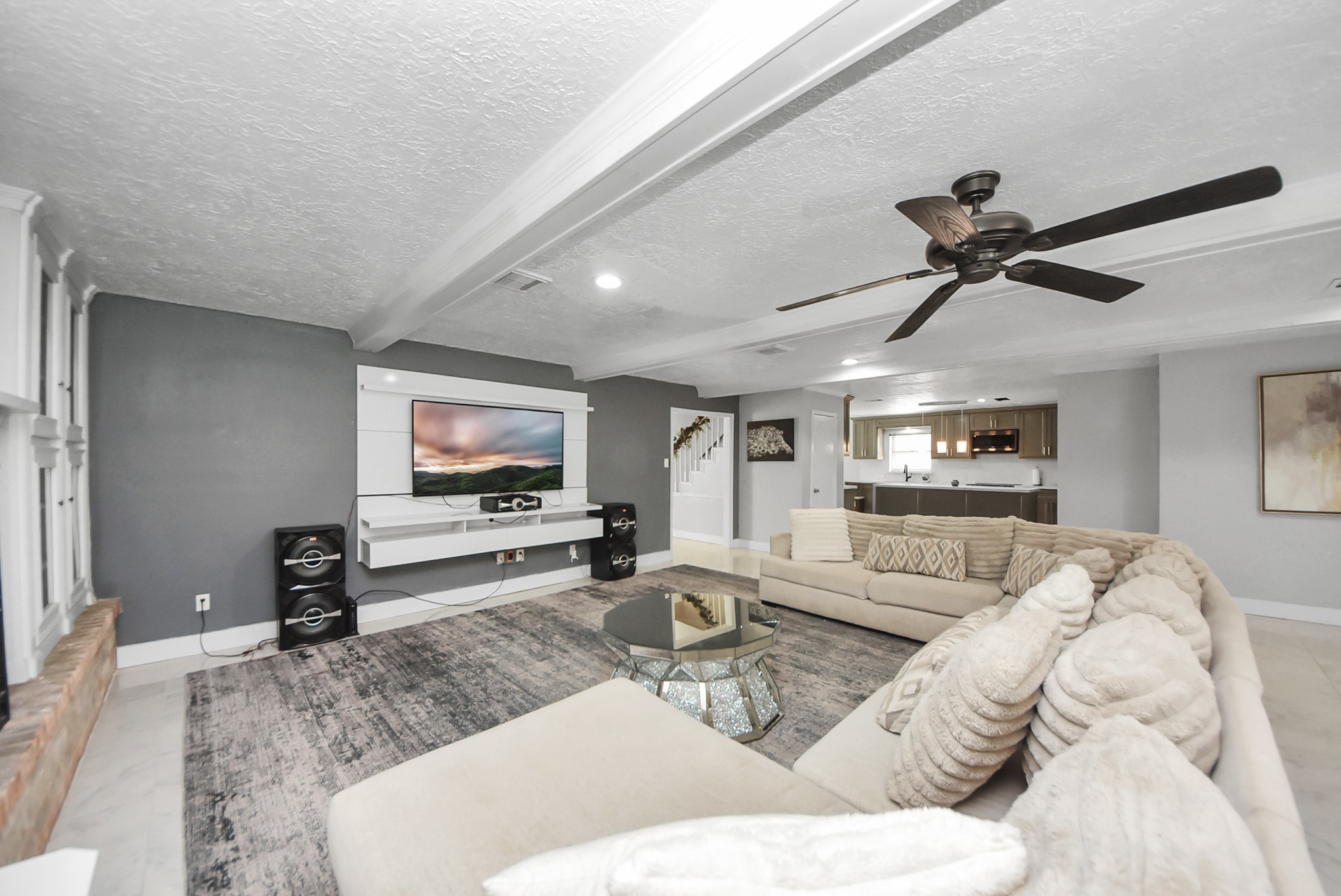 1011 Whitestone Lane Houston, TX 77073 - Photo 7 of 48 a living room with furniture and a flat screen tv with wooden floor
