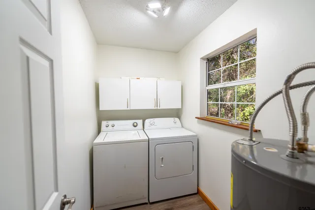 a view of storage and utility room with washer and dryer