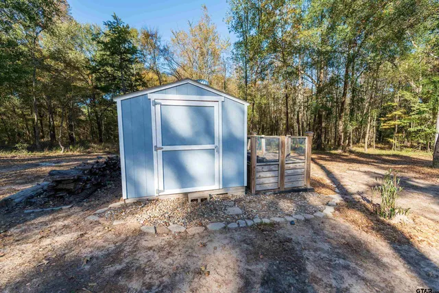 a backyard of a house with lots of green space