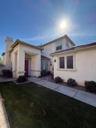 a view of a yard in front of a house with a yard