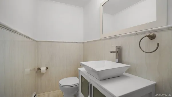 a bathroom with a toilet and a sink