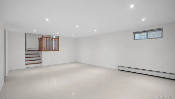 an empty room with stairs and ventilation