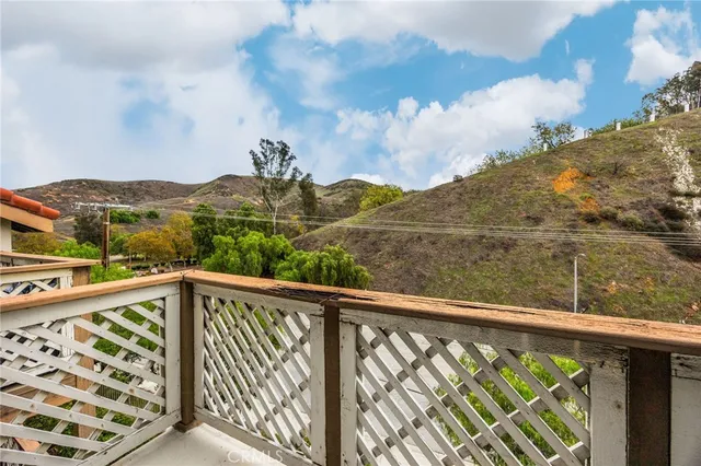 a view of balcony with furniture