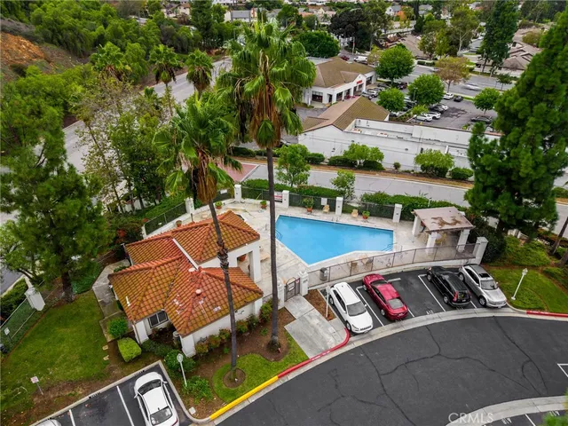 an aerial view of a house with swimming pool patio and outdoor seating