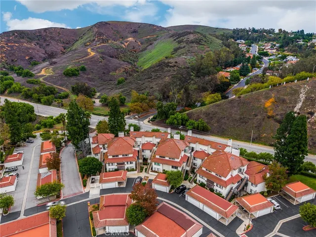 an aerial view of residential houses and outdoor space