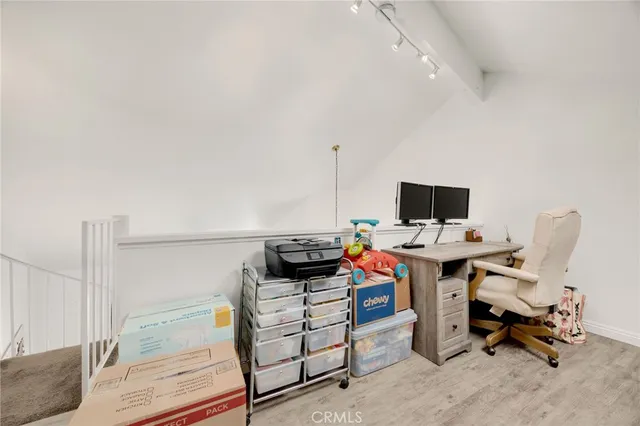 a view of a workspace with furniture