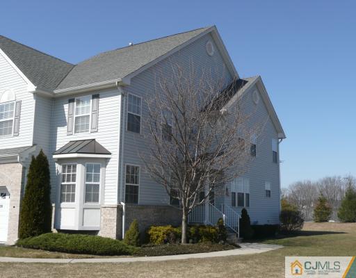 312 Hawthorne Road North Brunswick, NJ 08902 - Photo 1 of 10 a front view of a house with a yard