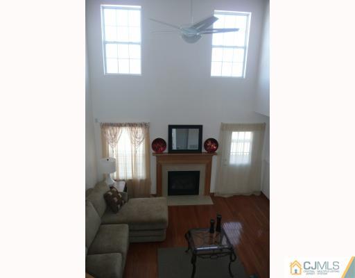 312 Hawthorne Road North Brunswick, NJ 08902 - Photo 3 of 10 a living room with furniture and a fireplace