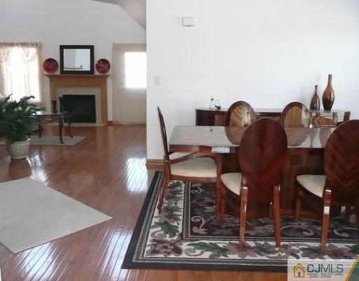 312 Hawthorne Road North Brunswick, NJ 08902 - Photo 4 of 10 a view of a livingroom with furniture and a fireplace