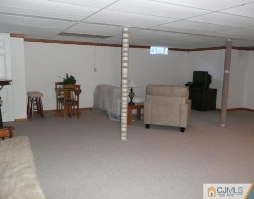 312 Hawthorne Road North Brunswick, NJ 08902 - Photo 9 of 10 a view of a livingroom with furniture and a couch