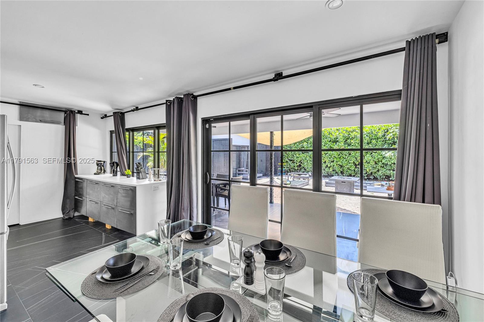 560 Northwest 116th Terrace Miami, FL 33168 - Photo 14 of 50 a living room with furniture and a large window