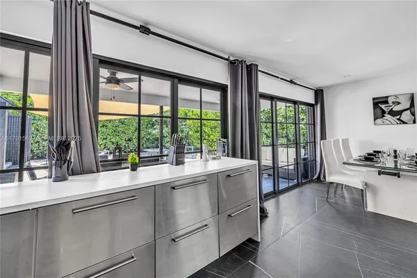 a kitchen with a sink and large window