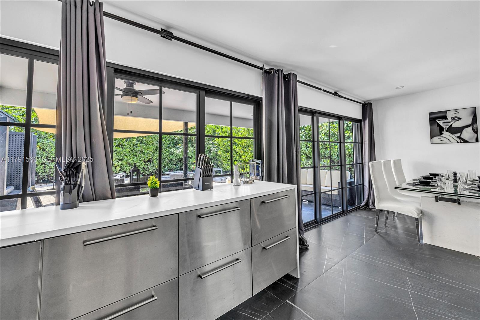 560 Northwest 116th Terrace Miami, FL 33168 - Photo 17 of 50 a kitchen with a sink and large window