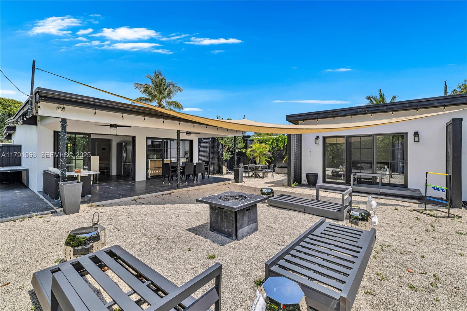 560 Northwest 116th Terrace Miami, FL 33168 - Photo 36 of 50 a view of a patio with table and chairs and potted plants