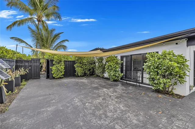 a view of a house with a street