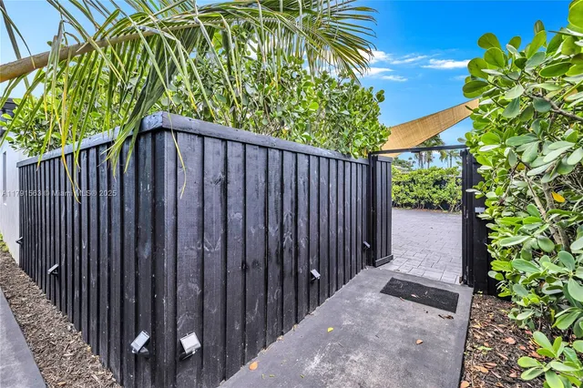 a view of a backyard with plants