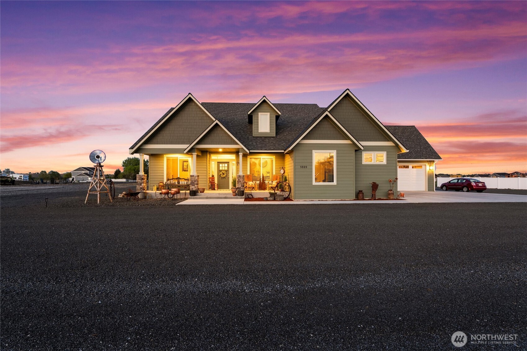 5889 Ne Road Moses Lake, WA 98837 - Photo 1 of 39 a front view of a house with a garden